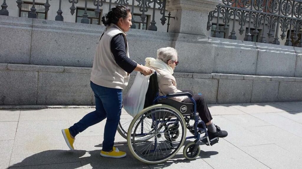 A domestic worker obtains a total permanent disability pension for her lower back pain after Social Security denied her several times
